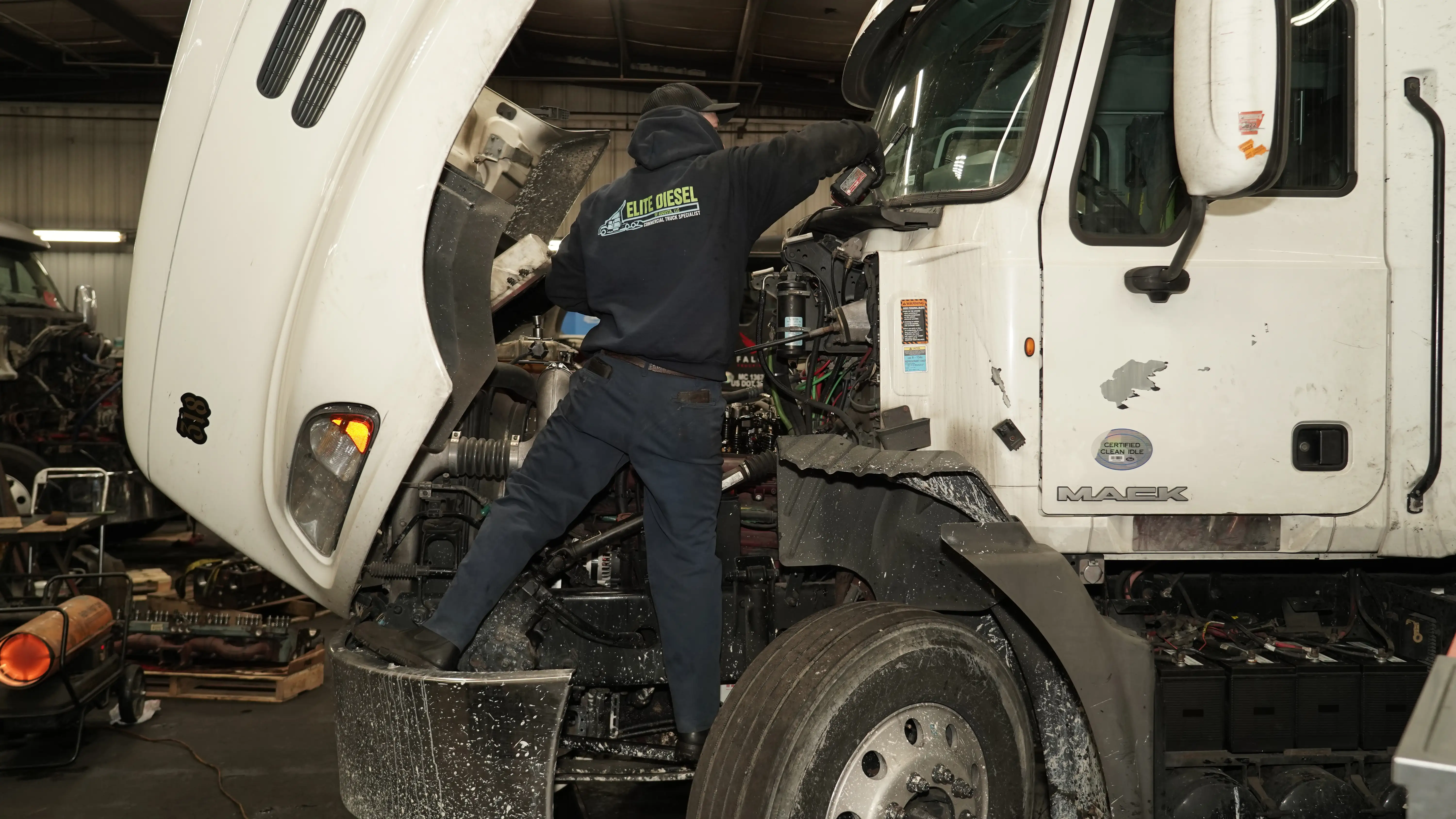 Diesel mechanic performing preventive maintenance services on semi truck in Savannah, GA
