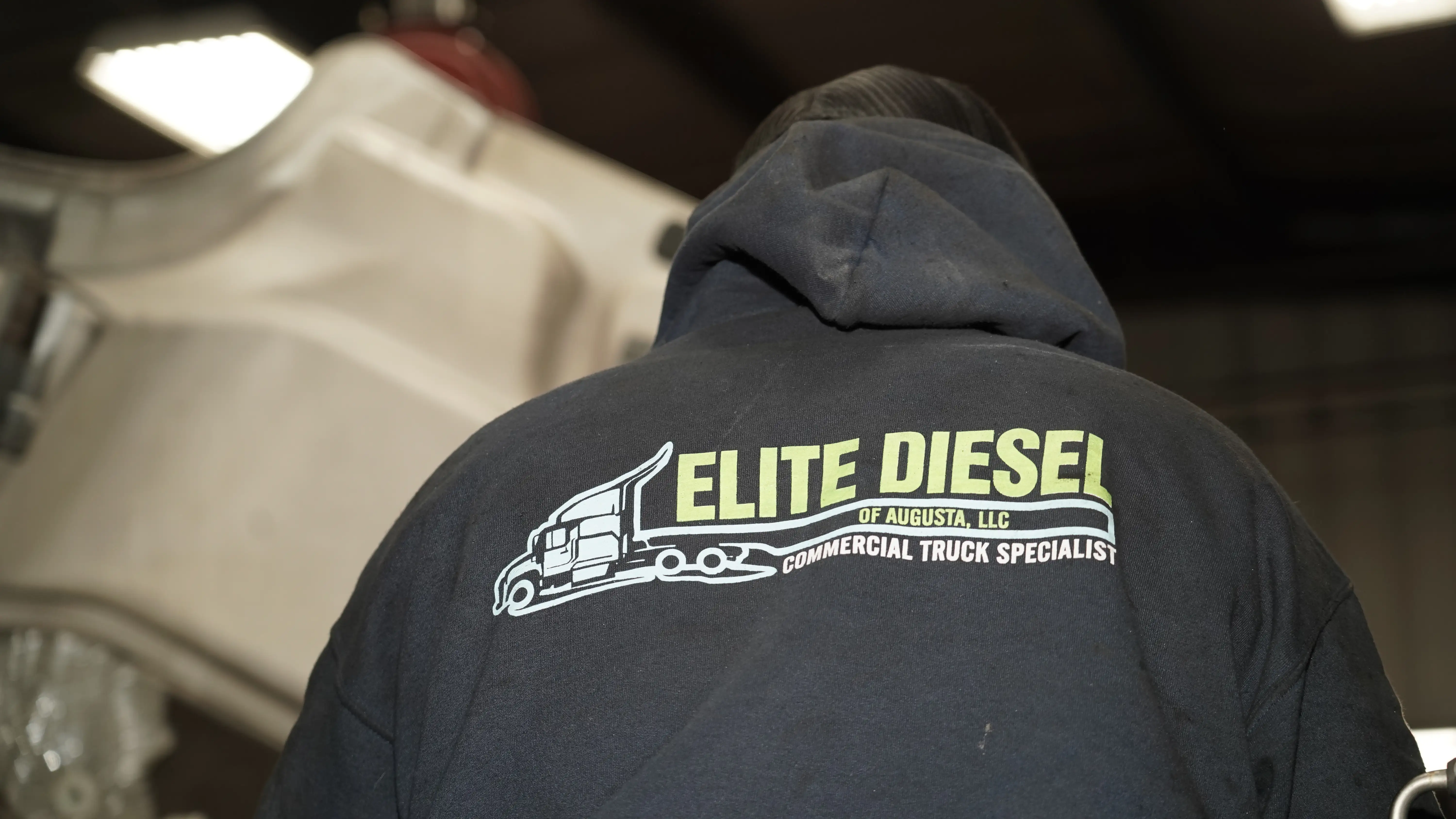 Diesel mechanic performing diesel repair services on semi truck in Augusta, GA